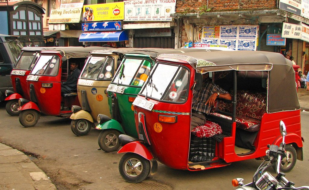Tuk-tuks waiting in Kandy — vehicle with driver hiring in Sri Lanka